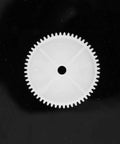 White plastic gear from 550 Gear Box Set For Kids Must Have Ride On Car Replacement Gears Kit on black background