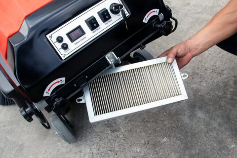 Top Shelf Electric Floor Sweeper Workhorse With A Spacious 41 Inch Sweep Path and filter being removed from unit.