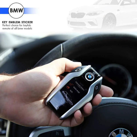 Key Fob Roundel Emblem For BMW 11mm Replacement Genuine OEM Part 66122155753 shown on a hand holding a BMW key fob inside a vehicle