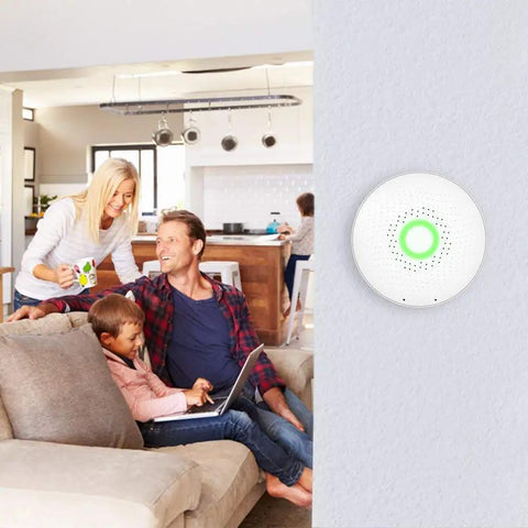Family in living room with Wave 1st Gen Radon Detector With Free App Real Time Monitoring Temp And Humidity Tracking Battery Operated