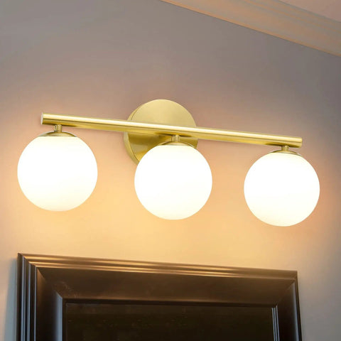 Rock A Stylish Mid Century Modern Vibe In Your Bathroom With These Three Light Gold Vanity Fixtures Complete With Frosted Milk Glass Globes
