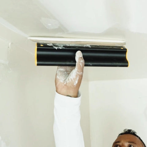 Pro Grade 16 Inch Drywall Skimming Blade With Extruded Aluminum Back And European Stainless Steel Blades in use on ceiling