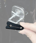 Universal Vehicle Door Buffers Knock Back The Heavy Slam With Chunky Silicone Shock Absorbers and Grip Tight Latch Protectors for Pickup Trucks, showing a hand holding a black silicone pad next to a door latch.