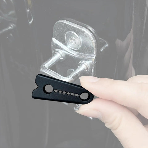 Universal Vehicle Door Buffers Knock Back The Heavy Slam With Chunky Silicone Shock Absorbers and Grip Tight Latch Protectors for Pickup Trucks, showing a hand holding a black silicone pad next to a door latch.