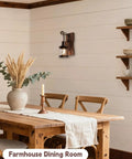 Industrial Farmhouse Wall Sconce With Rustic Wood Base And Glass Lantern Shade in a cozy farmhouse dining room setting.