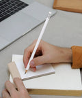 Person using a Beefy Heavy Duty Carpenter Pencils Set Of 10 White Woodworking Graphite Pencils With Erasers Round Barrel on notepad
