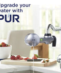 Metallic grey 3-In-1 Lead-Reducing Faucet Water Filter System for sink, mounted on kitchen faucet, kitchen background with food prep