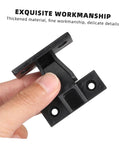 Hand holding a black concealed push on corner connector for wooden furniture and cabinets, showcasing fine craftsmanship.