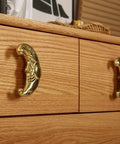 Sun Moon Cabinet Knobs Set, Solid Brass Antique Finish Drawer Pulls, installed on wooden dresser