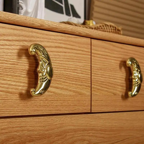 Sun Moon Cabinet Knobs Set, Solid Brass Antique Finish Drawer Pulls, installed on wooden dresser