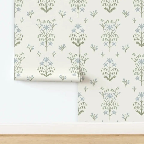 Premium Floral Meadow Wallcovering With A Subtle Matte Linen Texture Hits Different Across Every Room Built Tough For Busy Households Featuring No Sweat Paste To Paper Install showing floral pattern in green and blue.