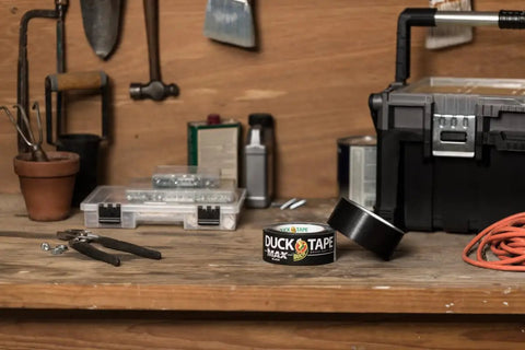 Max Strength Duct Tape Heavy Duty All Weather Waterproof Bond One Roll 1.88 Inch By 35 Yards Black Tough As Nails Tape on workbench