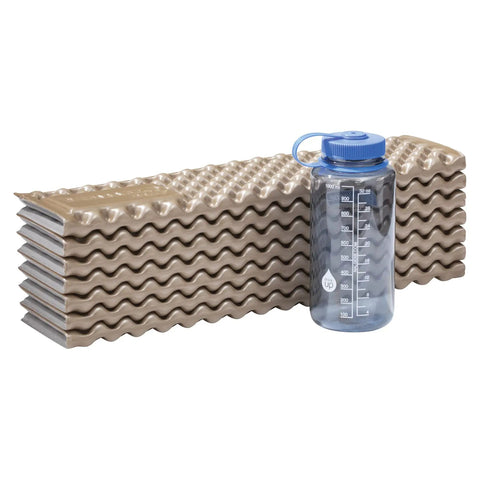 Z Lite Original Camping And Backpacking Sleeping Pad Lightweight Closed Cell Foam Ground Pad With Accordion Fold next to water bottle