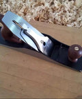 Professional Grade Number 5 1/2 Jointer Bench Plane With Hella Sharp Steel Blade on wooden surface for carpentry use.