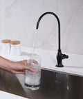 Top Shelf Stainless Steel Drinking Water Faucet For Under Sink Water Filter System Featuring Smooth Flow Non Air Gap RO Design Oil Rubbed Bronze Finish with water pouring into a glass.