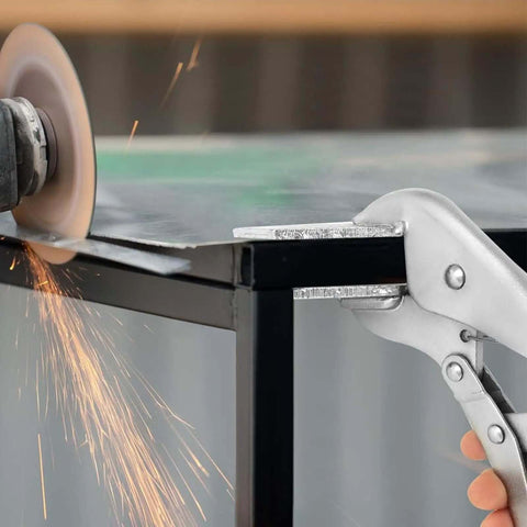 10 Inch Locking Sheet Metal Tool With Adjustable Opening in use, gripping a metal sheet during grinding, showcasing firm hold for DIY metalwork.