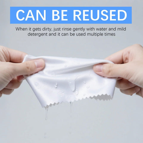 White microfiber cleaning cloth for glasses and screens being wrung by hands (close-up)