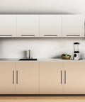 Modern kitchen with 12.6 inch square cabinet handles matte black pulls for kitchen cupboards and drawers installed on beige cabinets.