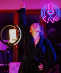 Person beneath Dimmable Neon Sign Live On Air USB LED Lights For Bedroom Wall Microphone Neon Decor For TikTok YouTube And Twitch Streamers