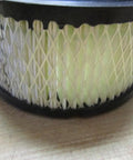 Close-up of High Performance Air Filter Element For Industrial Air Compressors Replacement Part 32170979 on wooden surface.
