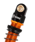 Close-up of top end of a 45mm Aluminum Threaded Oil Shock Absorber For One Twenty Fourth FCX24 And FMS RC Cars, black and gold finish.