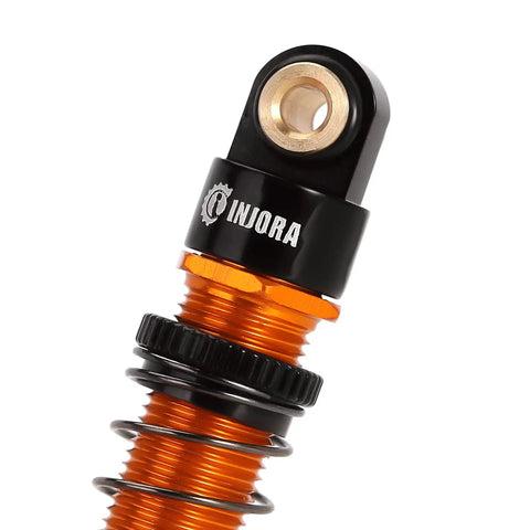 Close-up of top end of a 45mm Aluminum Threaded Oil Shock Absorber For One Twenty Fourth FCX24 And FMS RC Cars, black and gold finish.