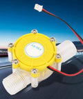 No-Fuss Micro Hydroelectric Generator For Off-Grid Power Quiet Water Turbine That Delivers 5V 12V Or 80V DC Output Durable Hydroelectric Energy Generator For DIY Projects And Small Power Needs shown in yellow and clear material with wiring.