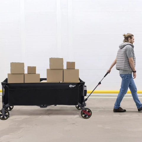 A person pulling a 51.2 Inch Long Foldable Wagon With Brakes And Cargo Net loaded with boxes, showcasing spacious utility.