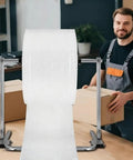 Heavy Duty Tabletop Bubble Wrap Dispenser for Effortless Ship Prep, showcasing a worker packing boxes with rapid bubble wrap access.