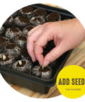 Hand planting seeds in Seed Starting Greenhouse Kit For Tomatoes And Vegetables, 16 Biodegradable Expanding Peat Pellets