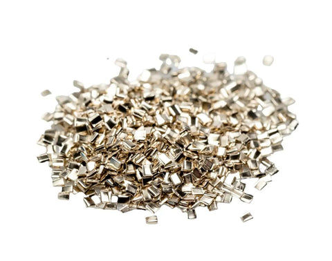 Hard Silver Solder Chips 3 Grams Approx 2000 Pieces 0.5 By 1.0 By 0.25mm Tiny Lead Free Cadmium Free Made In USA For Precision Electronics Soldering And Mini PCB Builds scattered on white background