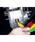 Hella Solid Brake Lining Thickness Gauge Sae And Metric Ruler For Disc And Drum Brakes color-coded steel tool checking brake pads.