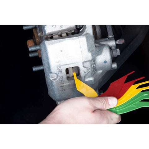 Hella Solid Brake Lining Thickness Gauge Sae And Metric Ruler For Disc And Drum Brakes color-coded steel tool checking brake pads.