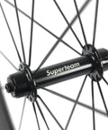 Close-up of hub on Beast 50mm Carbon Basalt Braking Surface Clincher Road Wheelset 700c with Matte 3k Finish Toray T700 Fibers