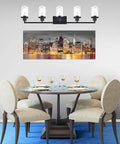 Dining area with round table, chairs, and 5-Light Vanity Lights Matte Black Finish, Farmhouse Industrial Wall Sconce With Clear Glass Shades.