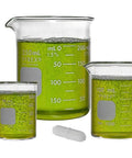 Griffin Low Form Glass Beaker Set With Magnetic Stir Bar Pyrex Borosilicate 50mL 100mL 250mL filled with green liquid, front view
