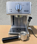 Silver 15 Bar Espresso Coffee Machine With Adjustable Brewing Controls For Homemade Cappuccinos And Lattes, front view with portafilter.