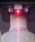 Precision Infrared Wheel Balancer Locator For Dead Nuts Precise Counterweight Targeting projecting red laser beam onto rim.