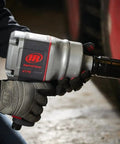 Person using 1 Inch Air Impact Wrench With D Handle 2100 Ft Lbs Max Torque Heavy Duty Pneumatic Tool For Trucks Buses And Semis