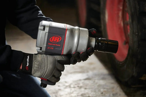 Person using 1 Inch Air Impact Wrench With D Handle 2100 Ft Lbs Max Torque Heavy Duty Pneumatic Tool For Trucks Buses And Semis