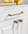 Champagne Bronze Cabinet Pulls 5 Inch 128mm 10 Pack Cupboard Handles For Kitchen Cabinets And Drawers Durable Cabinet Hardware For Modern Home Renovation installed on white cabinet