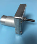 Heavy Duty Dc Geared Motor For Dishwasher Dispenser Detergent Pump 24V with metal casing and shaft, side view on blue background.