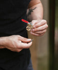 Person holding Tough As Nails Four Inch Mini Ball Valve With Slick Lever Handle and threaded end for plumbing use.
