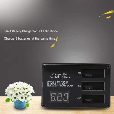 3 Bay Fast Charging Station for Tello Drone Batteries with LED display on wooden surface beside a small plant