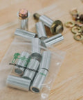 Aluminum Spacer Three Quarters Inch OD Three Eighths Inch ID Choose Your Length Unthreaded Round Standoff Bushing Plain Finish Fits Three Eighths Inch Bolts Or M10 6061 Aluminum Alloy Pack Of Ten on a table