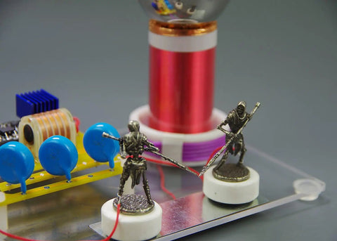Tabletop Tesla Coil DIY Kit With Spark Gap High Voltage Science Educational Toy For Electrical Hobbyists Easy Assembly In About 1 To 2 Hours Includes Step By Step Guide And 12V Power Supply Prep, tabletop kit with red coil, blue capacitors, and metal electrodes