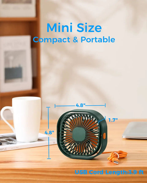 4 Inch USB Desk Fan With 3 Speed Portable Mini Cooling Fan on a desk next to a coffee cup, showing size dimensions.