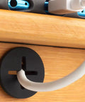 Close-up of 3/4 Inch Cable Grommet Set For Desks And Furniture, Silicone Rubber Black Hole Covers, 8 Pack For Cable Management And Wire Pass Through, 19mm Fit, Keeps Cords Neat And Tidy.