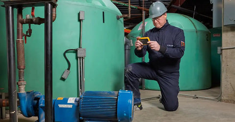 Technician using PTi120 Pocket Thermal Imager For Quick Infrared Inspections And Temperature Scans On The Go in industrial setting