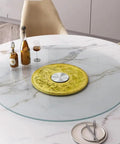 Large Tabletop Rotating Lazy Susan Turntable In Bright Yellow With Slick Silent Spin And Zero Drama Tempered Glass Build That Runs As A Sweet Kitchen Workhorse For Families on a dining table with glass top.